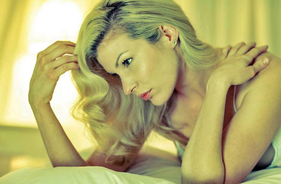 Emily West with a golden light